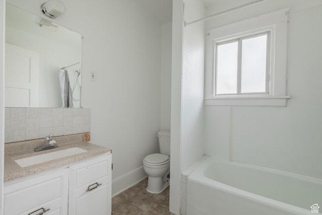 98 S Center St, Redmond, UT 84652 - bathroom featuring toilet, baseboards, vanity, a shower, and a tub