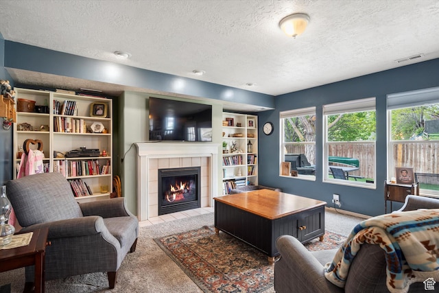 3347 N 1150 E, Layton, UT 84040 - living room with a textured ceiling, light carpet, healthy amount of natural light, and a tiled fireplace