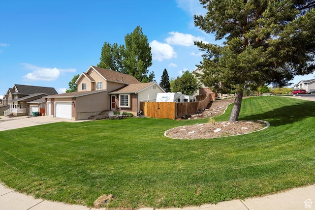 3347 N 1150 E, Layton, UT 84040 - view of front of home featuring concrete driveway, a garage, brick siding, and stucco siding