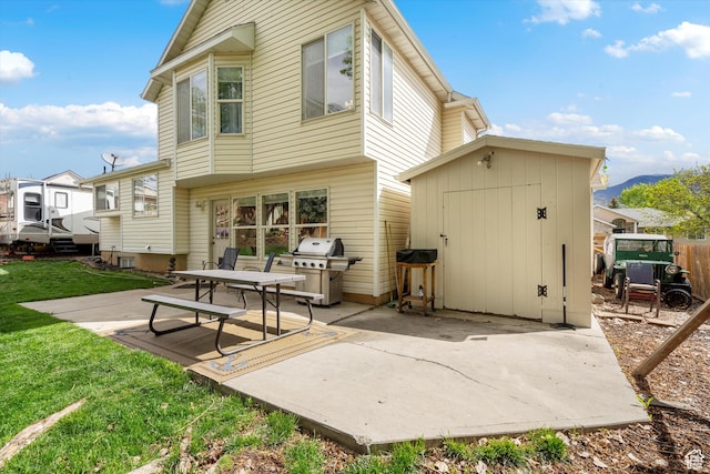 3347 N 1150 E, Layton, UT 84040 - back of house with a patio, a yard, a shed, an outdoor structure, and a mountain view