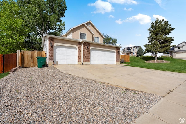 3347 N 1150 E, Layton, UT 84040 - traditional-style home with an attached garage, brick siding, and concrete driveway