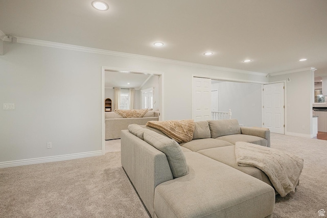 living area featuring light colored carpet, crown molding, recessed lighting, and baseboards