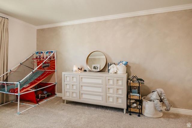 recreation room featuring light colored carpet, crown molding, and baseboards