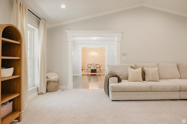 living area featuring a chandelier, carpet, vaulted ceiling, and baseboards