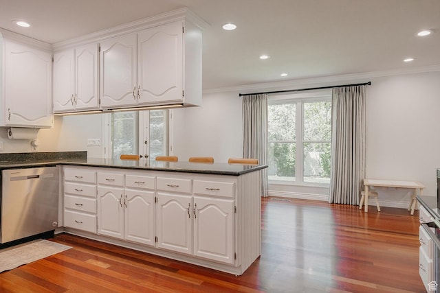 kitchen with stainless steel dishwasher, ornamental molding, light wood-style floors, white cabinetry, and recessed lighting