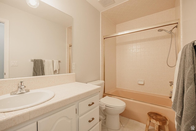 bathroom featuring toilet, tile patterned flooring, vanity, and shower / tub combination