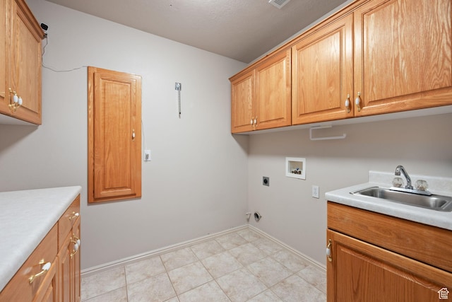laundry area with cabinet space, hookup for a washing machine, hookup for an electric dryer, and baseboards
