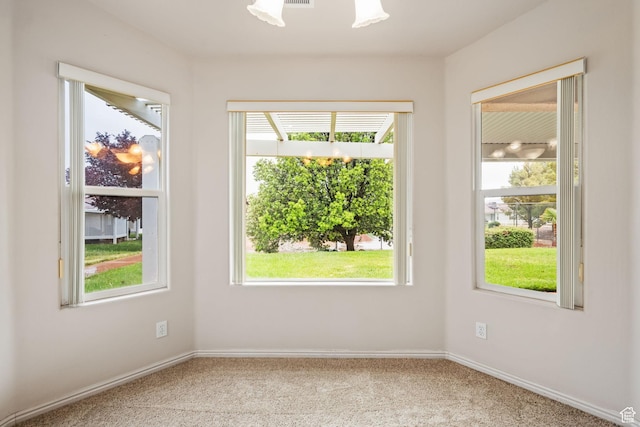 spare room with carpet flooring and baseboards