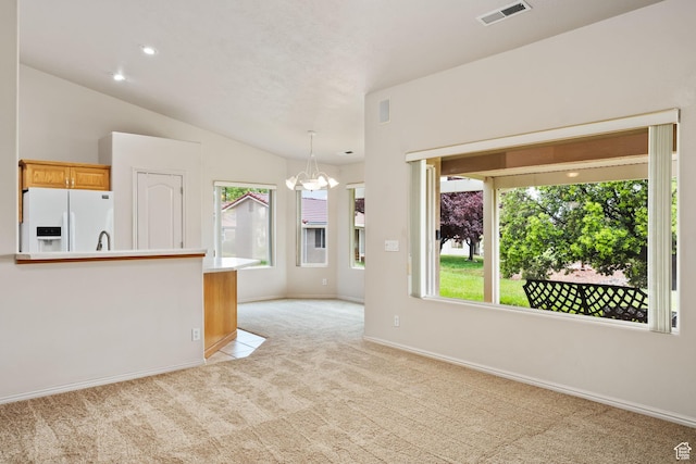 unfurnished living room featuring a chandelier, light carpet, baseboards, lofted ceiling, and recessed lighting