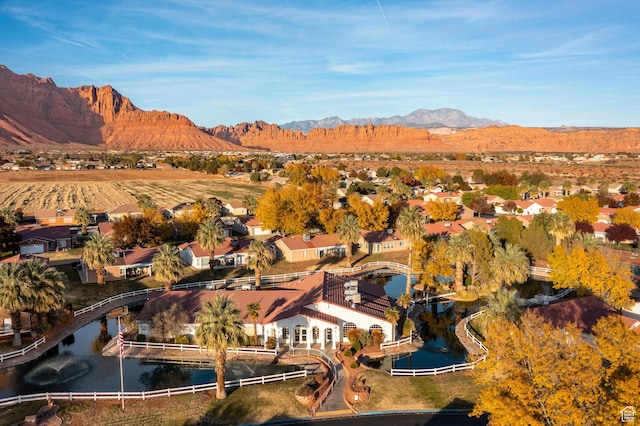aerial overview of property's location with nearby suburban area and a water and mountain view