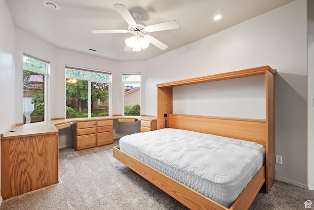 bedroom featuring light colored carpet, a desk, recessed lighting, and a ceiling fan