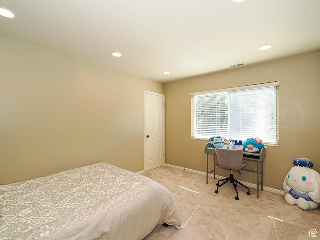 carpeted bedroom featuring baseboards and recessed lighting