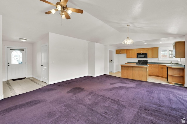 3267 S 1350 W, Perry, UT 84302 - unfurnished living room with lofted ceiling, a ceiling fan, baseboards, plenty of natural light, and a sink