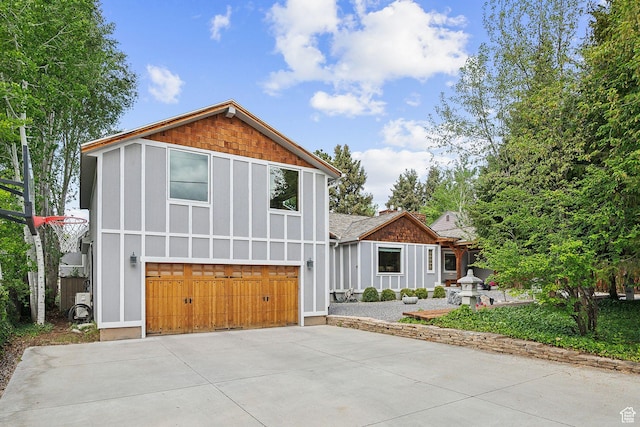2625 E Kentucky Ave, Holladay, UT 84117 - view of front of property with a garage, driveway, and board and batten siding