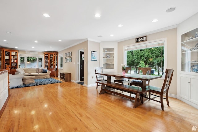 2625 E Kentucky Ave, Holladay, UT 84117 - dining area with built in shelves, recessed lighting, light wood-style flooring, crown molding, and baseboards