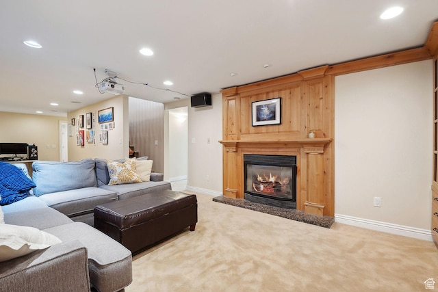 2625 E Kentucky Ave, Holladay, UT 84117 - living room featuring recessed lighting, carpet flooring, a glass covered fireplace, and baseboards