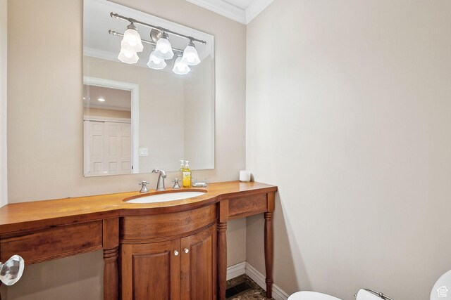 2625 E Kentucky Ave, Holladay, UT 84117 - half bathroom with crown molding, toilet, vanity, and baseboards