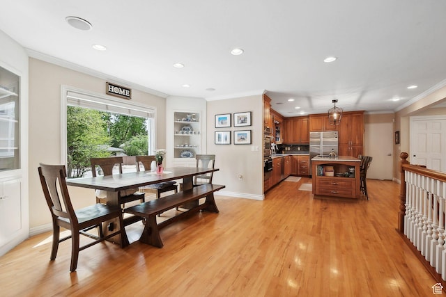 2625 E Kentucky Ave, Holladay, UT 84117 - dining room with recessed lighting, ornamental molding, light wood-style floors, built in shelves, and baseboards
