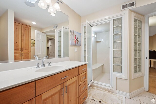 2625 E Kentucky Ave, Holladay, UT 84117 - bathroom with tile patterned flooring, a shower stall, vanity, a chandelier, and a closet