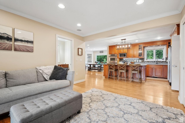 2625 E Kentucky Ave, Holladay, UT 84117 - living room with ornamental molding, light wood-style floors, and recessed lighting