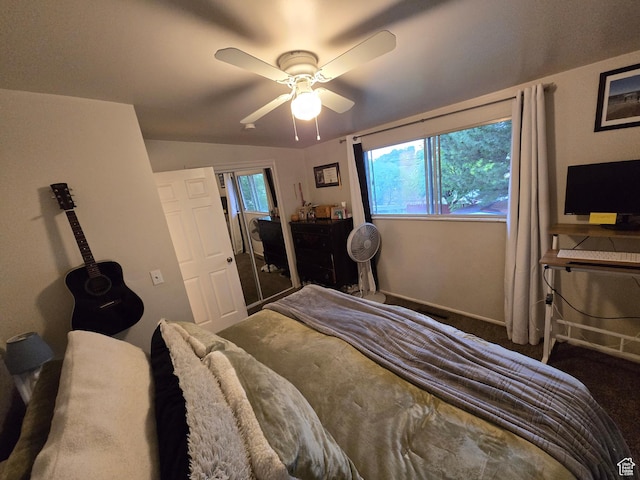 bedroom with a ceiling fan, carpet floors, baseboards, and vaulted ceiling