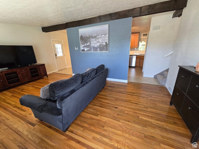 614 W Anderson Ave S, Murray, UT 84123 - living area featuring a textured ceiling and light wood-style flooring
