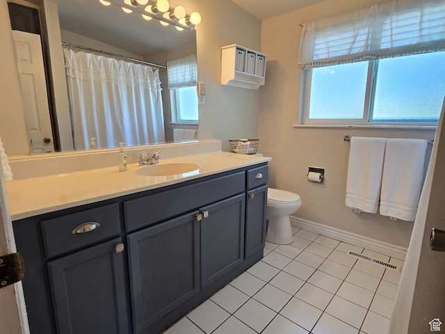 614 W Anderson Ave S, Murray, UT 84123 - bathroom featuring healthy amount of natural light, vanity, and tile patterned flooring