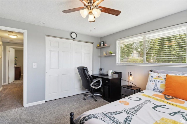 2884 N 300 E, North Ogden, UT 84414 - carpeted bedroom with a closet, a desk, a textured ceiling, a ceiling fan, and baseboards