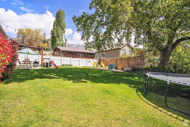 2884 N 300 E, North Ogden, UT 84414 - view of yard with a trampoline and a playground