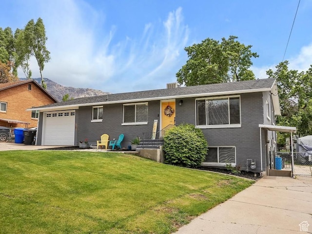 2884 N 300 E, North Ogden, UT 84414 - view of front facade with a garage, concrete driveway, and brick siding