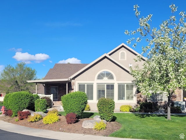 186 S 1900 W Unit R2, Lehi, UT 84043 - view of front of house with stone siding, a front lawn, and stucco siding