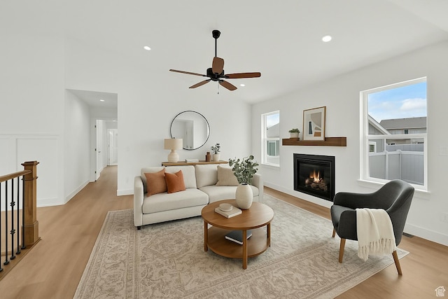 1765 W 650 S, Marriott Slaterville, UT 84404 - living room with light wood-style floors, a glass covered fireplace, a ceiling fan, recessed lighting, and baseboards