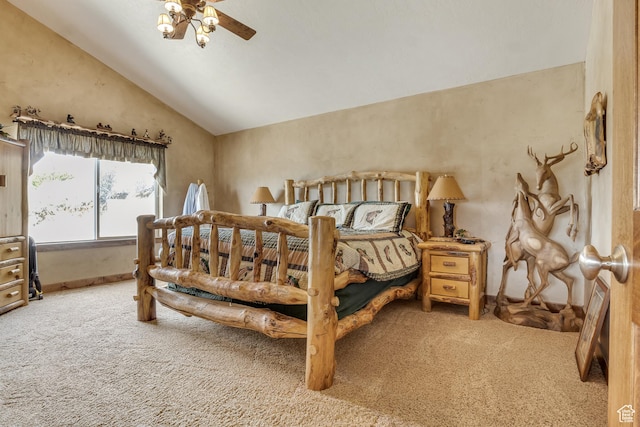 carpeted bedroom with lofted ceiling