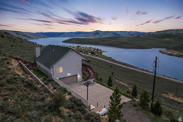 view of subject property with a water and mountain view