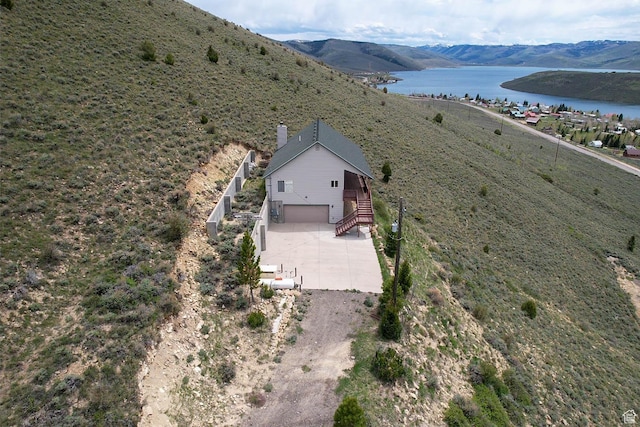 view of subject property featuring a water and mountain view