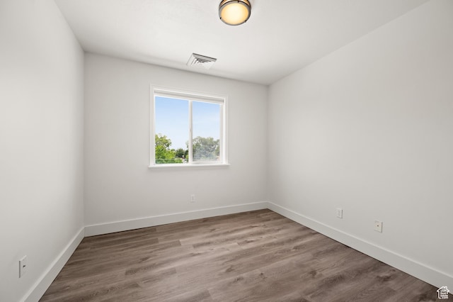 3860 S Mccall St E Unit 3C, Salt Lake City, UT 84115 - empty room featuring baseboards and wood finished floors