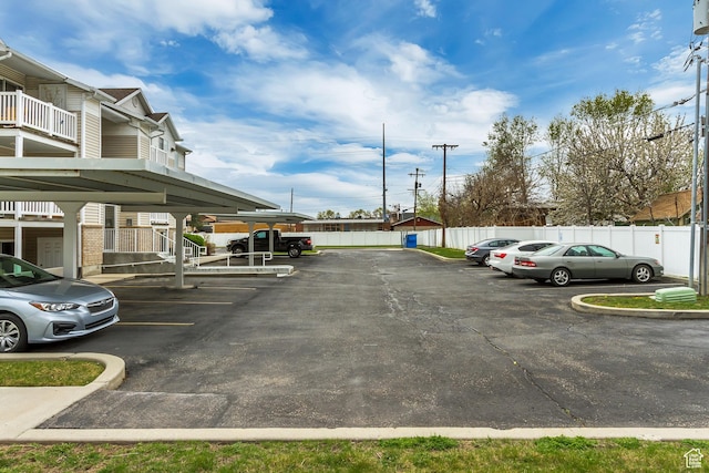 3860 S Mccall St E Unit 3C, Salt Lake City, UT 84115 - partially covered parking lot featuring fence