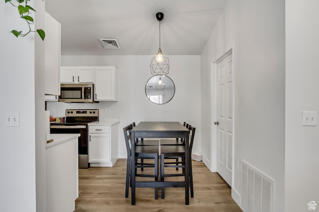 3860 S Mccall St E Unit 3C, Salt Lake City, UT 84115 - dining space with light wood-style flooring and baseboards