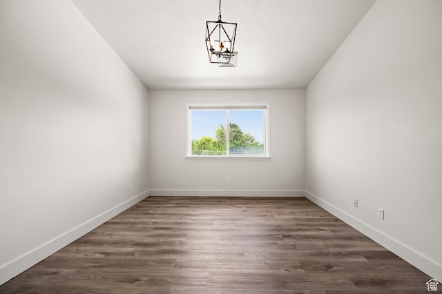 3860 S Mccall St E Unit 3C, Salt Lake City, UT 84115 - unfurnished dining area featuring a chandelier, baseboards, and dark wood finished floors