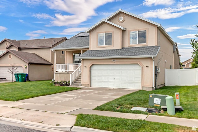2012 S 575 W, Lehi, UT 84043 - view of front of home featuring stucco siding, concrete driveway, a garage, solar panels, and roof with shingles