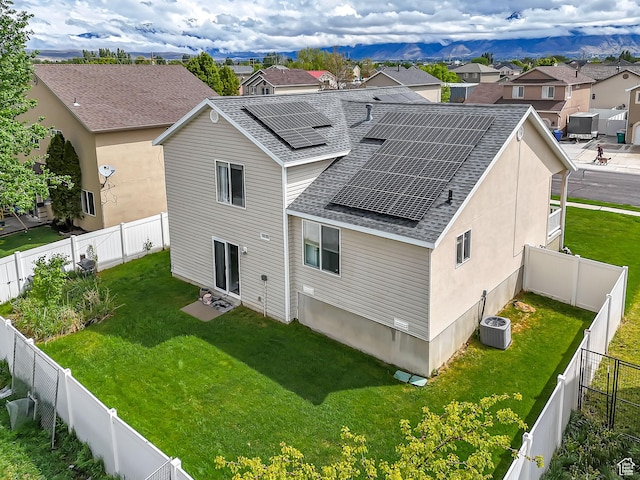 2012 S 575 W, Lehi, UT 84043 - rear view of house featuring a shingled roof, a residential view, roof mounted solar panels, and central AC unit