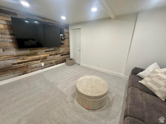 living area with recessed lighting, carpet, wood walls, and baseboards