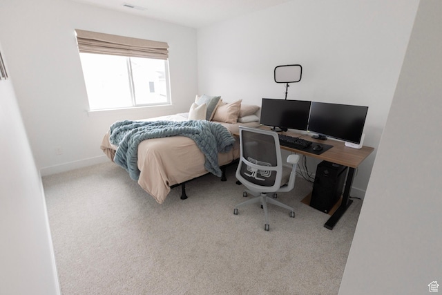 bedroom featuring carpet and baseboards