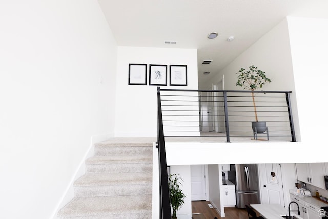 stairway with wood finished floors
