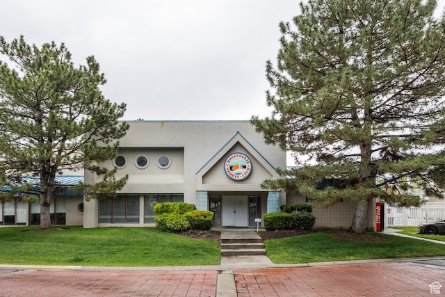 1443 W Spinnaker Row S, Taylorsville, UT 84123 - view of front of home featuring stucco siding