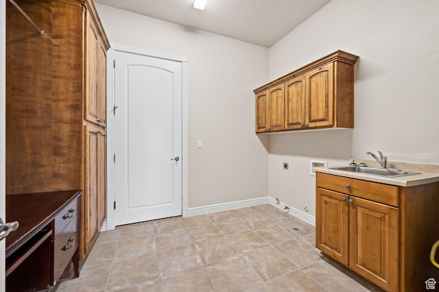 laundry area featuring gas dryer hookup, electric dryer hookup, hookup for a washing machine, cabinet space, and baseboards