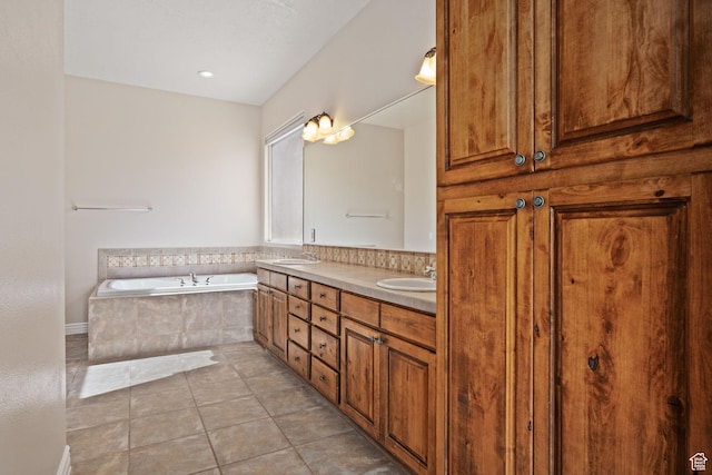 full bath with a bath, tile patterned floors, and double vanity