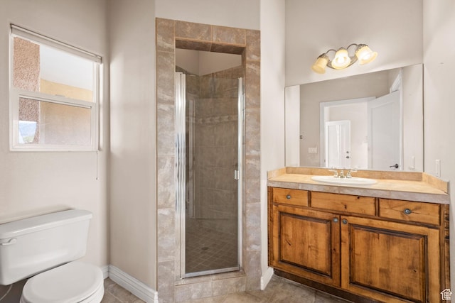 full bath with a stall shower, toilet, baseboards, and vanity