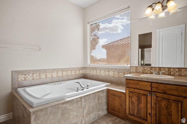 bathroom featuring a garden tub and vanity