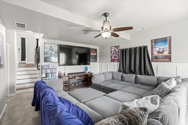 971 W Farnham Dr, North Salt Lake, UT 84054 - living area featuring ceiling fan, carpet floors, stairs, a wainscoted wall, and a decorative wall